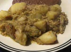 Una foto de Carnitas de cerdo con papas