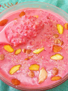 A picture of Daliya kheer with dry fruit and juice beetroot.