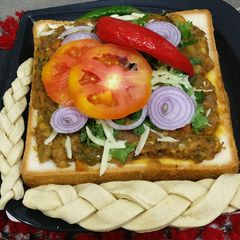 A picture of Pav bhaji open sandwich.