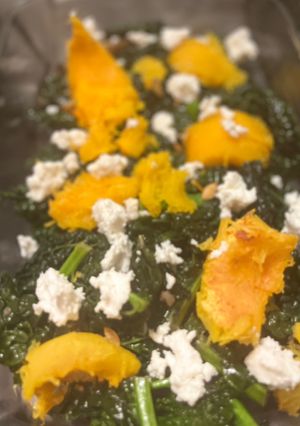 A picture of Kale, roasted pumpkin and goat cheese salad.