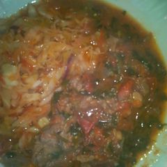 A picture of Beef stew and cabbage.