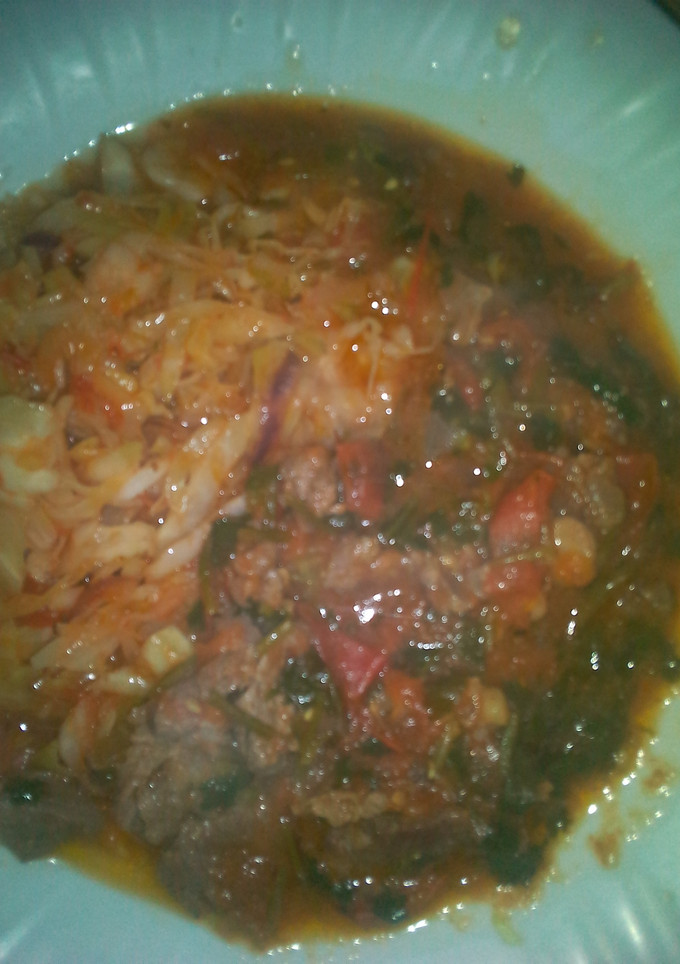 A picture of Beef stew and cabbage.