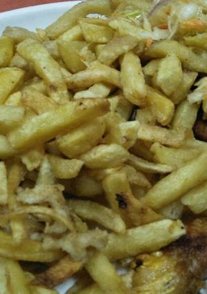 A picture of Fries with chicken.