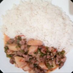Potatoes and beef stew served with Rice A picture of Potatoes and beef stew served with Rice.