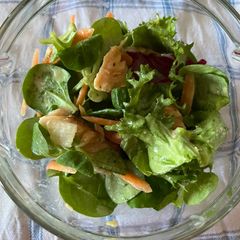 A picture of Salad with salmon and honey-mustard dressing.