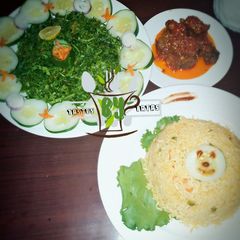 A picture of Jollof Rice served with salad and pepper meat #contest.