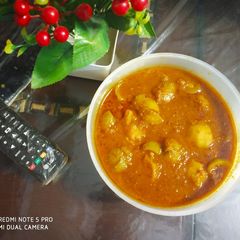A picture of Stuffed Tinda Curry.