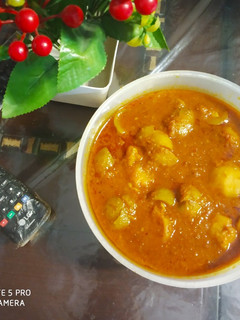 A picture of Stuffed Tinda Curry.