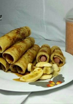 A picture of Honey Dripping Hot dog Pancakes with banana Toppings & Smoothies.
