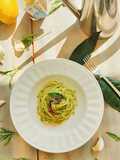 Spaghetti con pesto di limone, rucola e Alici di Cetara