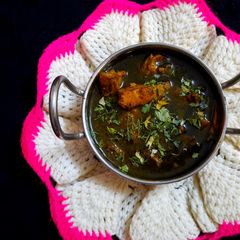 A picture of Black chicken masala.
