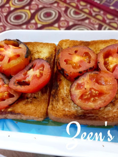 A picture of Garlic Bread Toast with Roasted Tomatoes.