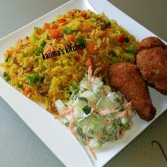 A picture of Fried rice and chicken.