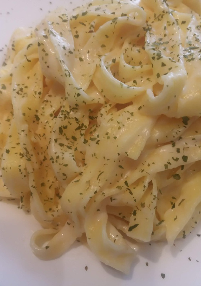 Una foto de Tagliatelle con salsa de queso