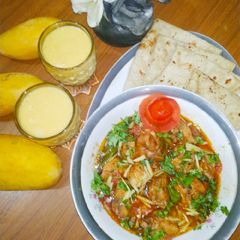 Chicken Karahi with chapati and mango shake A picture of Chicken Karahi with chapati and mango shake.