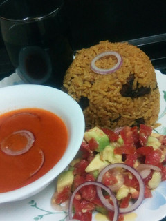 A picture of Pilau with spicy tomato soup.