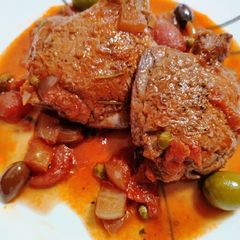 A picture of Braised chicken and olives.