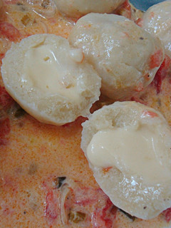 Una foto de Ñoquis rellenos de queso!