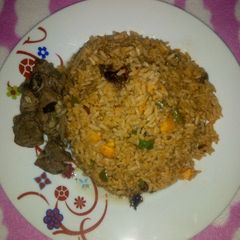 A picture of Jollof rice & Pepper Soup.