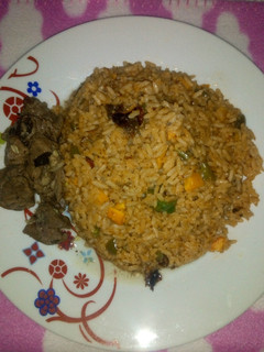 A picture of Jollof rice & Pepper Soup.