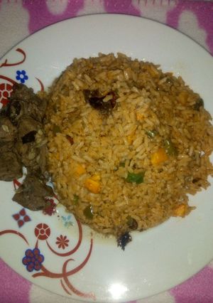 A picture of Jollof rice & Pepper Soup.