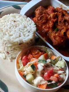 A picture of Chicken Chakalaka,white rice and Rainbow Salad.