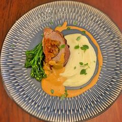 A picture of Prosciutto wrapped pork fillet with chorizo stuffing.