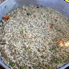 A picture of White rice with green pepper.