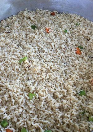 A picture of White rice with green pepper.