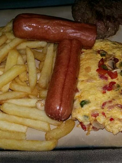 A picture of Breakfast: Chips & Egg.