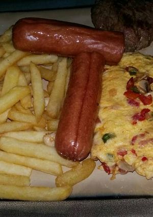 A picture of Breakfast: Chips & Egg.