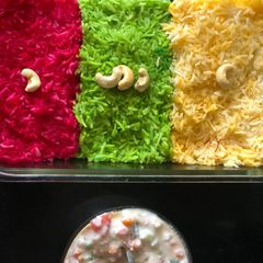 A picture of Tricolor Rice with Vegetable Raita.