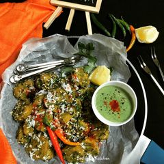 A picture of Palak Muthia (Steamed Spinach Dumplings).