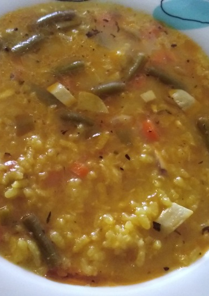 Una foto de Arroz caldoso de pescado con verduras