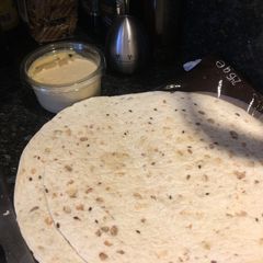 A picture of Houmous on wraps.