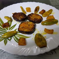 A picture of Bhaja (Brinjal Fry, pumpkin fry, pointed gourd).