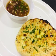 A picture of Paneer, cheese kulcha.