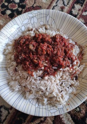 A picture of Rice with beans and stew.