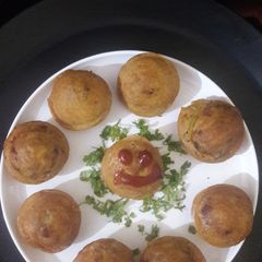 Aloo bonda in appam pan A picture of Aloo bonda in appam pan.