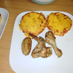 Creamy Pap topped with cheese served with roasted chicken A picture of Creamy Pap topped with cheese served with roasted chicken.
