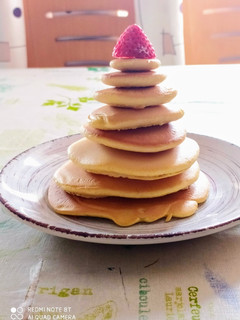 Una foto de Pancakes americanos con miel