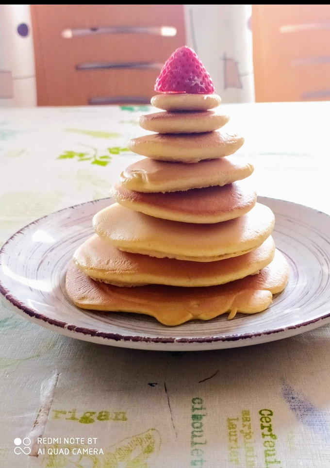 Una foto de Pancakes americanos con miel