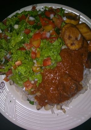 A picture of White rice&beans with stew.