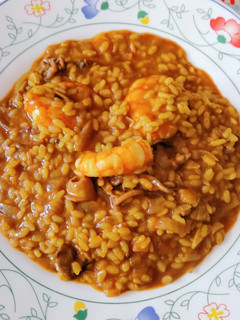 Una foto de Arroz meloso de chipirones y gambón