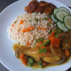 A picture of Rice and chicken sauce.
