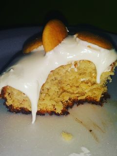 A picture of Banana Pudding Cake with Cream Cheese fluff icing.