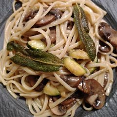 A picture of Mushroom linguine with zucchini and sage.