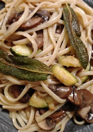 A picture of Mushroom linguine with zucchini and sage.