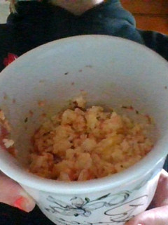 A picture of Scrambled eggs in a cup.