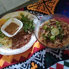 A picture of Beef haleem with boil rice.